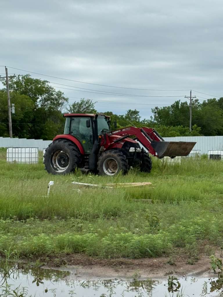 Tractor parked by the barn